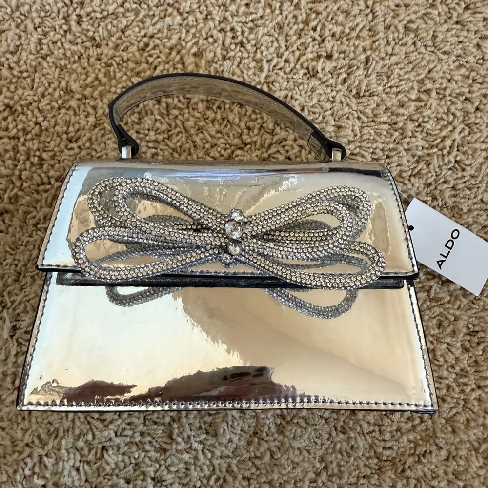 Aldo Silver Clutch with Rhinestone Bow
